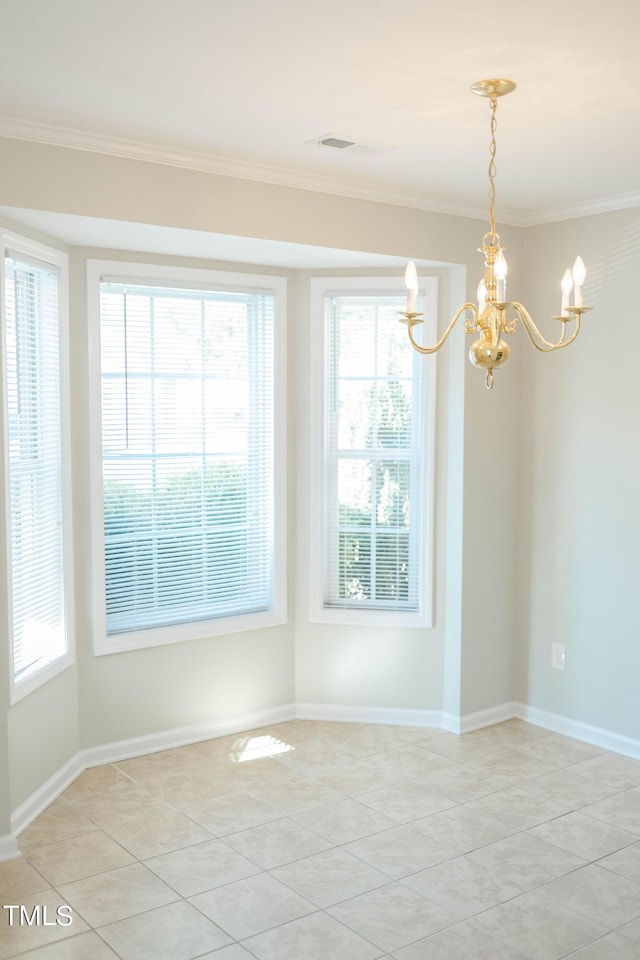 tiled spare room featuring crown molding, an inviting chandelier, and a wealth of natural light