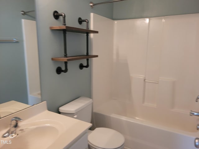 full bathroom with sink, washtub / shower combination, and toilet