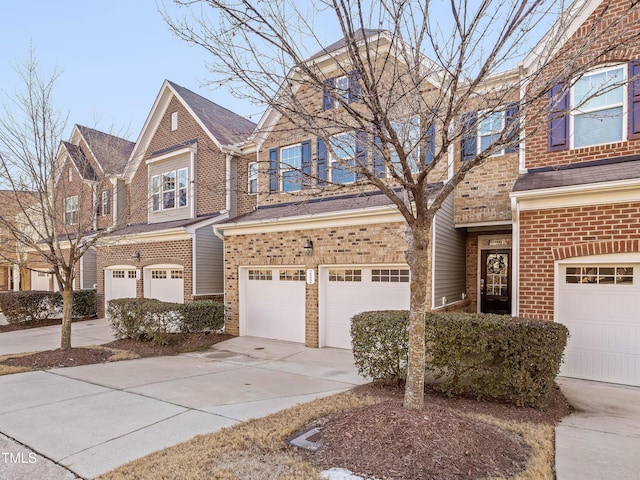 townhome / multi-family property featuring a garage