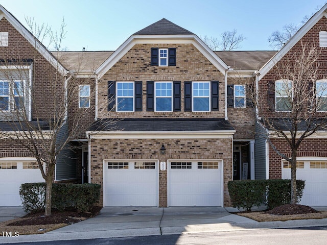 multi unit property featuring a garage