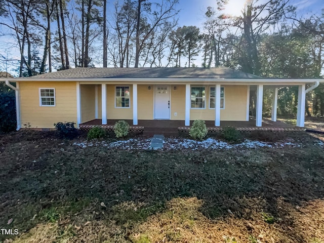 ranch-style house with covered porch