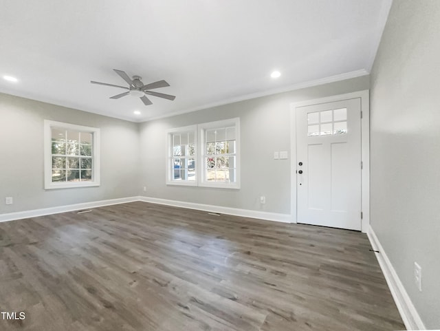 foyer entrance featuring crown molding, ceiling fan, and dark hardwood / wood-style floors