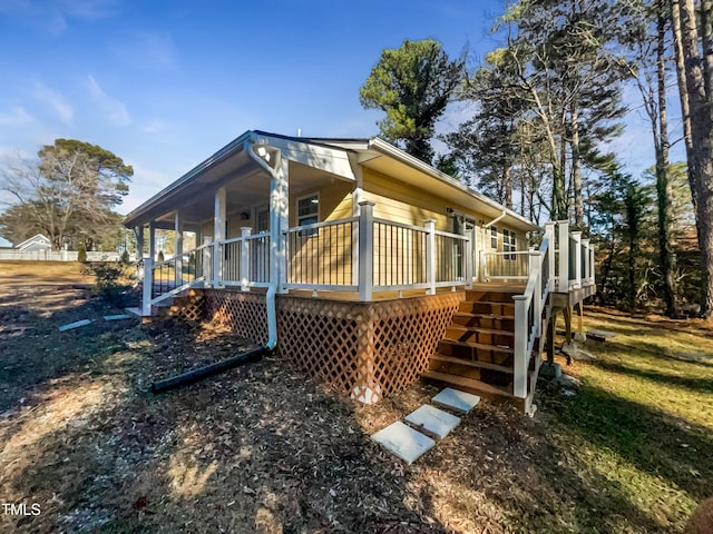 view of home's exterior featuring a wooden deck