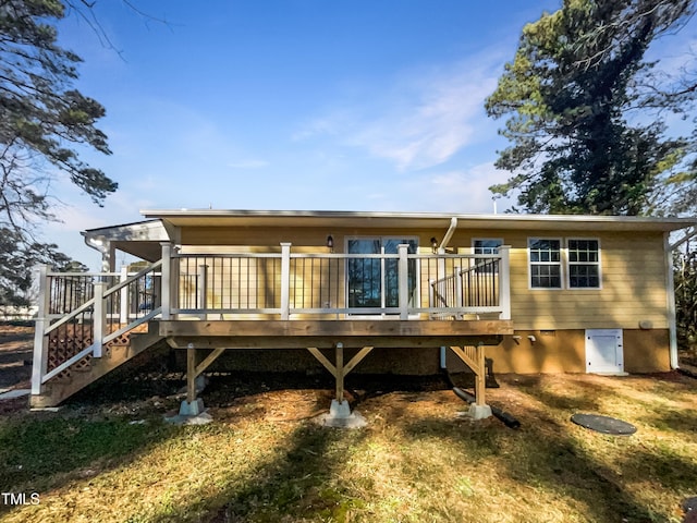 back of house featuring a deck