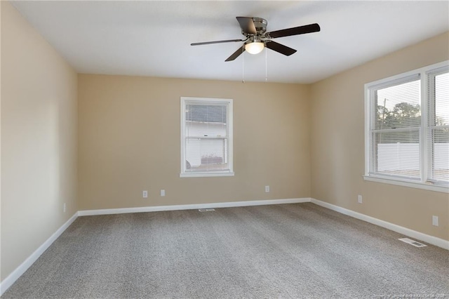 unfurnished room featuring carpet and ceiling fan