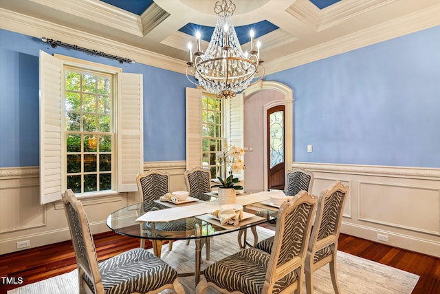 dining room with coffered ceiling, beam ceiling, and ornamental molding