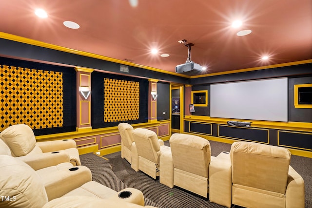 carpeted cinema featuring crown molding