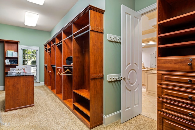 spacious closet featuring light tile patterned flooring