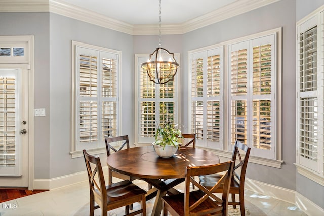 tiled dining space with ornamental molding and a chandelier