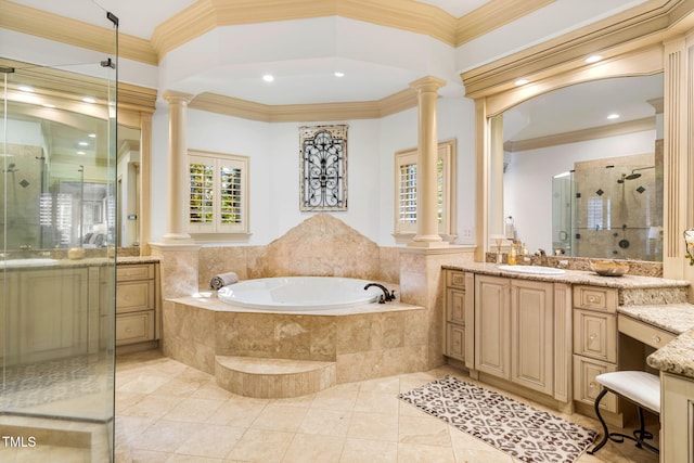 bathroom with ornate columns, vanity, and ornamental molding