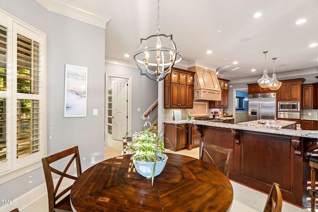 dining room featuring ornamental molding and a chandelier