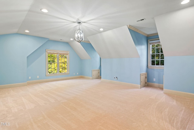 additional living space with lofted ceiling and light carpet