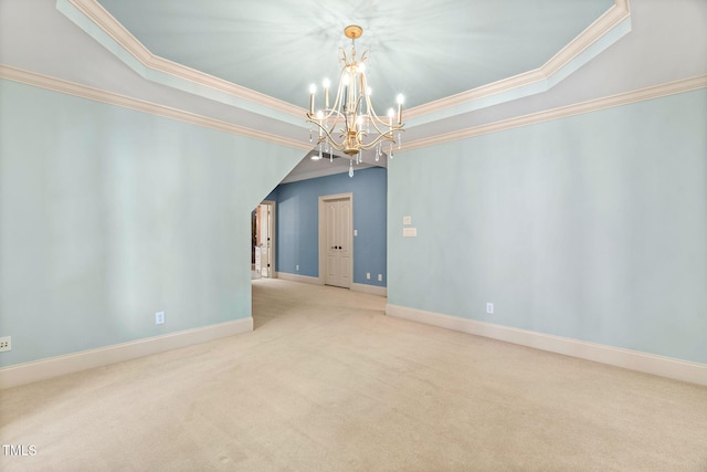 carpeted spare room with crown molding, a raised ceiling, and a chandelier