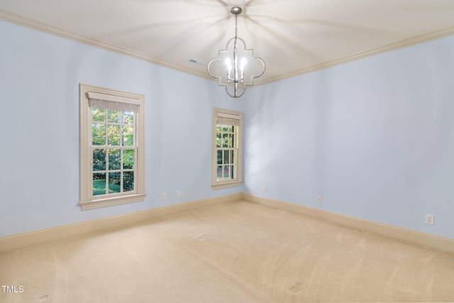 empty room featuring crown molding, an inviting chandelier, and carpet