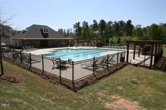 view of swimming pool with a yard and a patio area