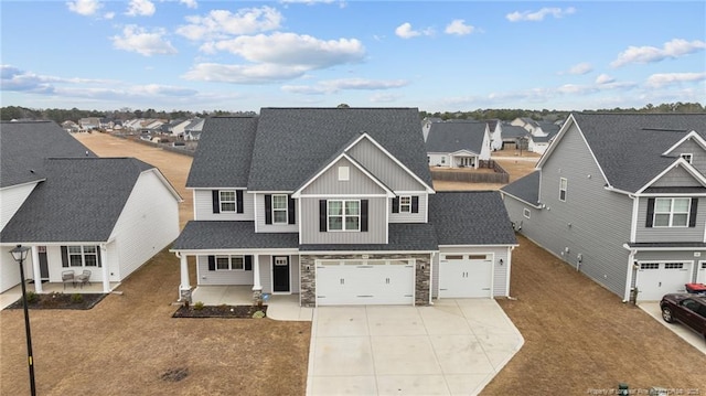 view of front property with a garage and covered porch