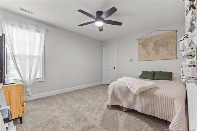 carpeted bedroom with ceiling fan