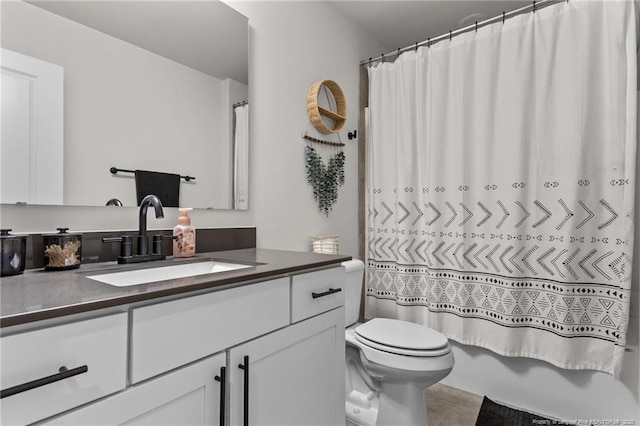 full bathroom featuring vanity, shower / tub combo, tile patterned floors, and toilet