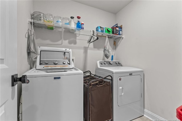 laundry area with independent washer and dryer