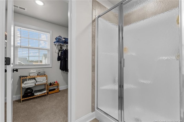 bathroom featuring an enclosed shower