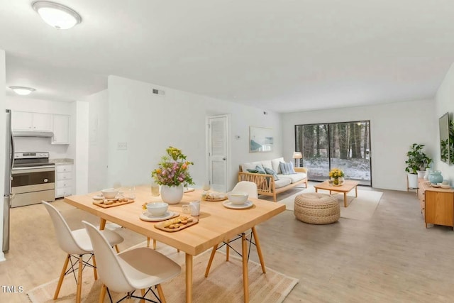 dining area featuring light hardwood / wood-style flooring