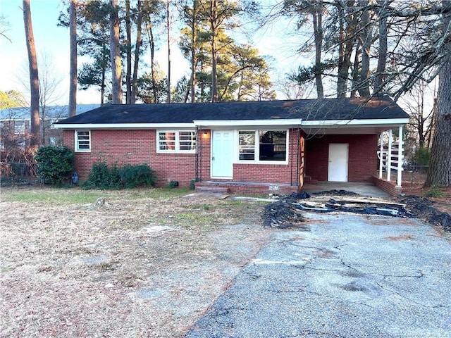 ranch-style home with a carport