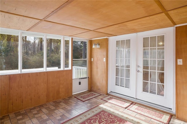 unfurnished sunroom featuring wooden ceiling and french doors