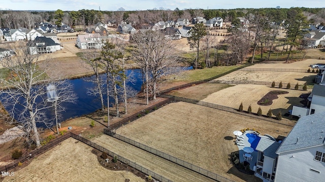 bird's eye view with a water view and a residential view