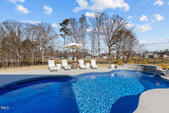 view of swimming pool with a fenced backyard, a fenced in pool, and a patio