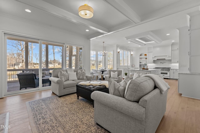 living area with light wood-type flooring, beam ceiling, and recessed lighting