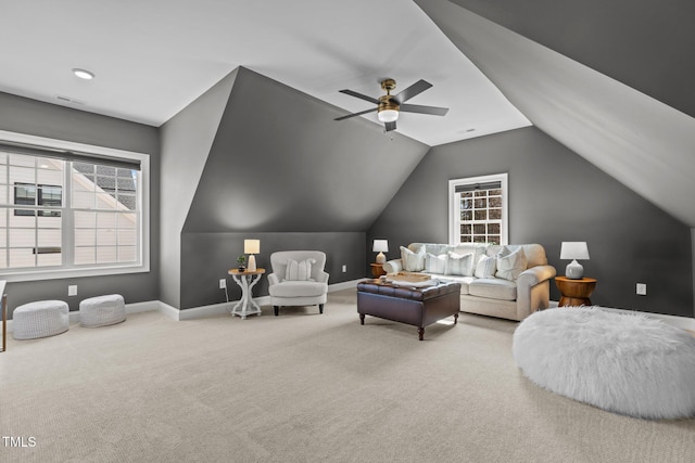 living area with lofted ceiling, carpet, and baseboards