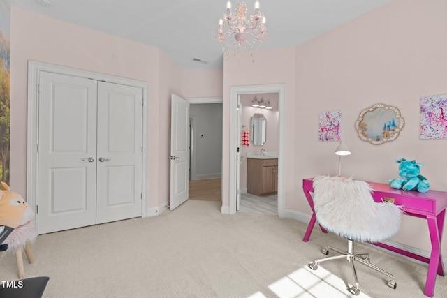 interior space featuring a sink, baseboards, and an inviting chandelier