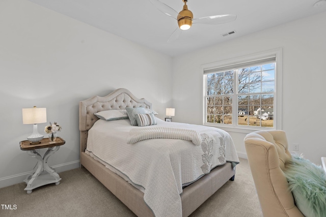 bedroom featuring light carpet, ceiling fan, visible vents, and baseboards