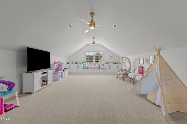 recreation room featuring vaulted ceiling, carpet floors, ceiling fan, and visible vents