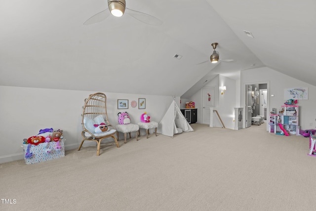 playroom featuring ceiling fan, carpet floors, vaulted ceiling, and visible vents