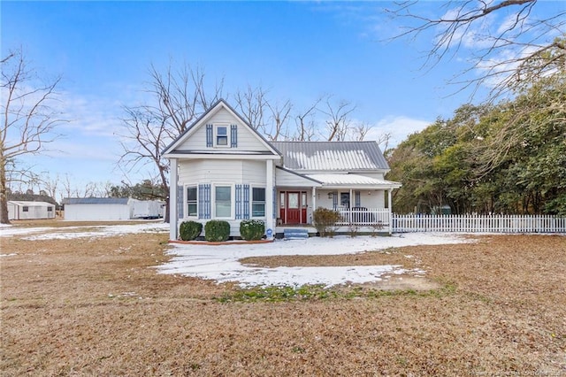 view of front property featuring a porch and a front yard