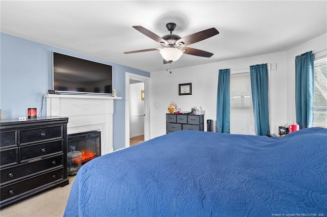 carpeted bedroom featuring ceiling fan