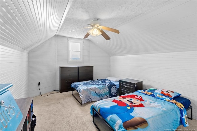 carpeted bedroom with ceiling fan, lofted ceiling, and a textured ceiling