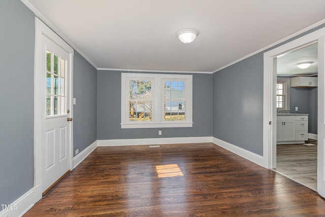 interior space with crown molding and dark hardwood / wood-style flooring