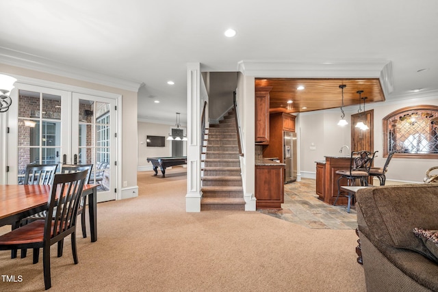 carpeted living room featuring ornamental molding, billiards, sink, and french doors