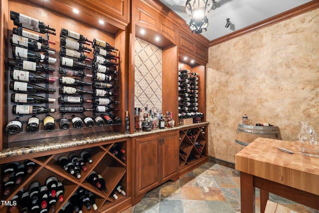 wine room featuring crown molding