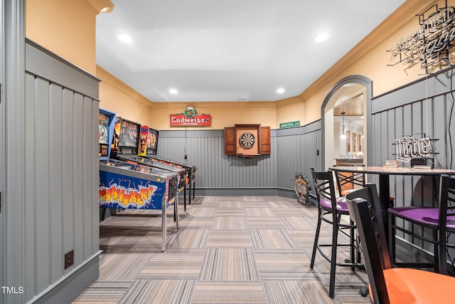 interior space featuring crown molding and carpet flooring