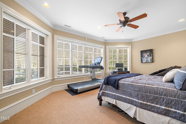 carpeted bedroom featuring ceiling fan and ornamental molding