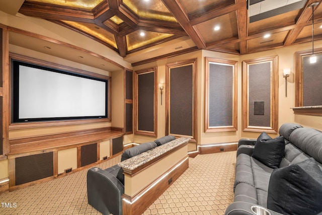 home theater room with beamed ceiling, ornamental molding, coffered ceiling, and carpet