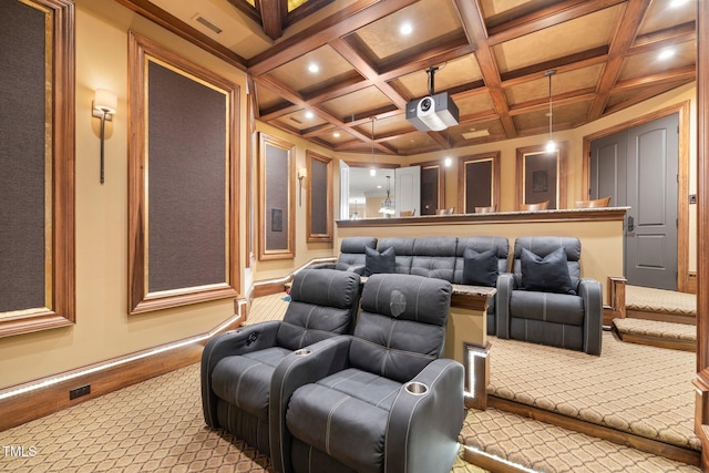 home theater room featuring beamed ceiling, light colored carpet, and coffered ceiling