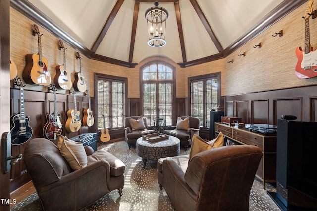 interior space featuring beam ceiling, a notable chandelier, and high vaulted ceiling