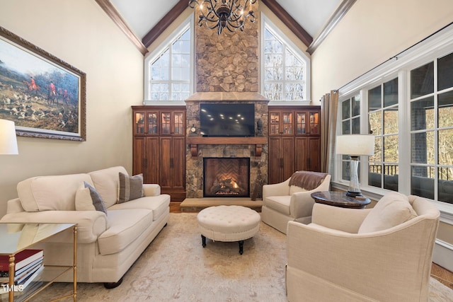 living room featuring a fireplace, high vaulted ceiling, and a chandelier