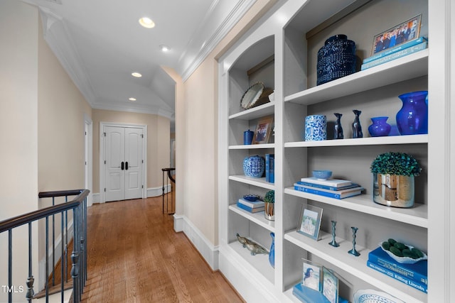 hall featuring crown molding and wood-type flooring