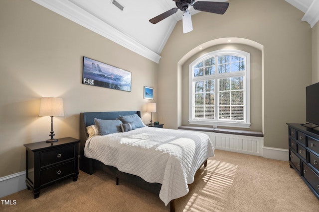 carpeted bedroom with ornamental molding, lofted ceiling, and ceiling fan