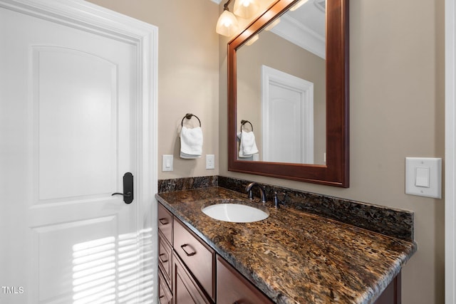 bathroom with vanity and crown molding